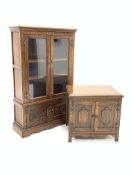 20th century oak bookcase, with two glazed doors enclosing two adjustable shelves,