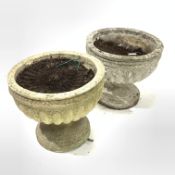 Pair reconstituted stone garden pedestal urns with gadroon moulding,