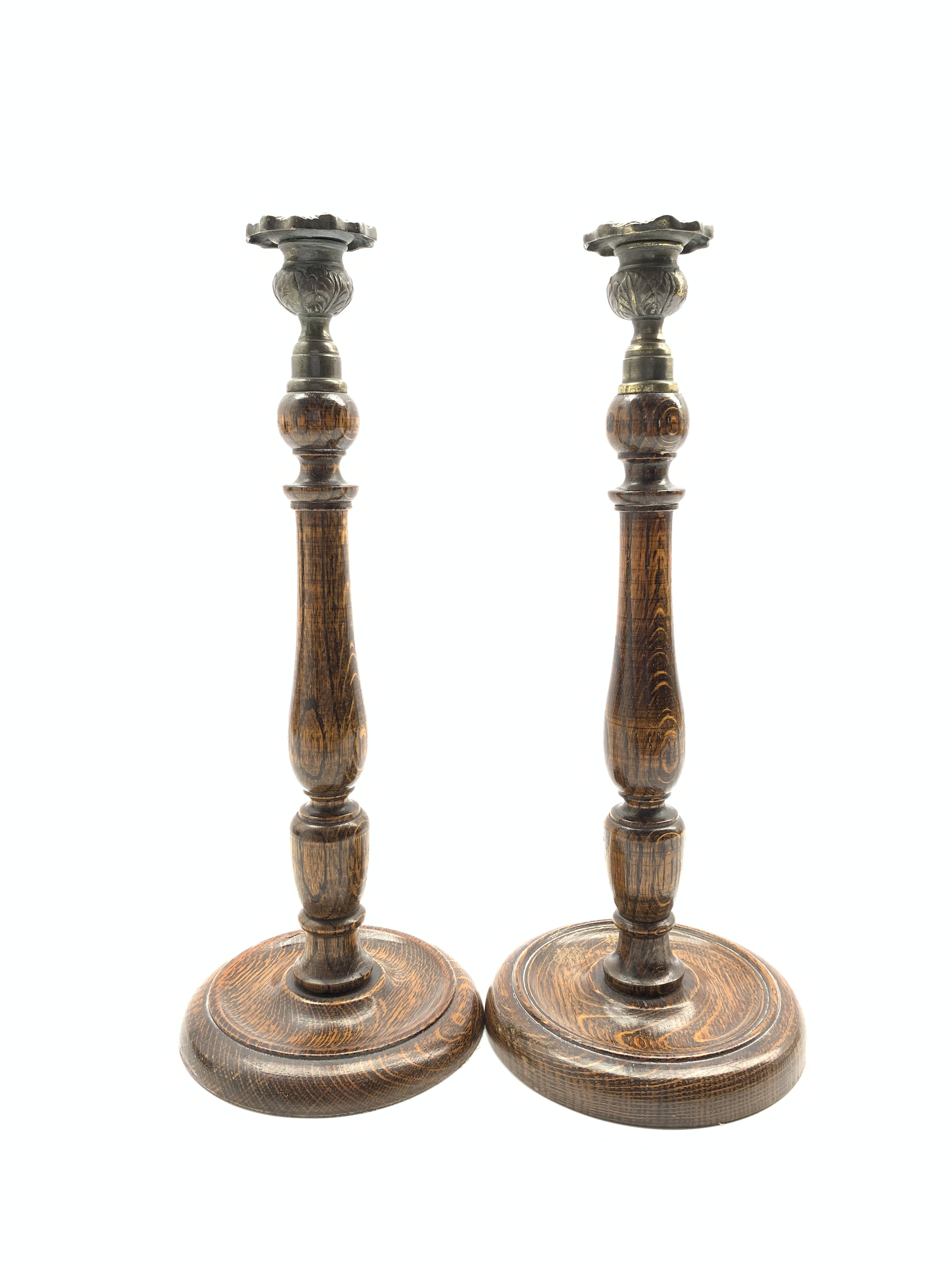 Near pair of oak candlesticks with baluster stems and circular bases H36cm Condition