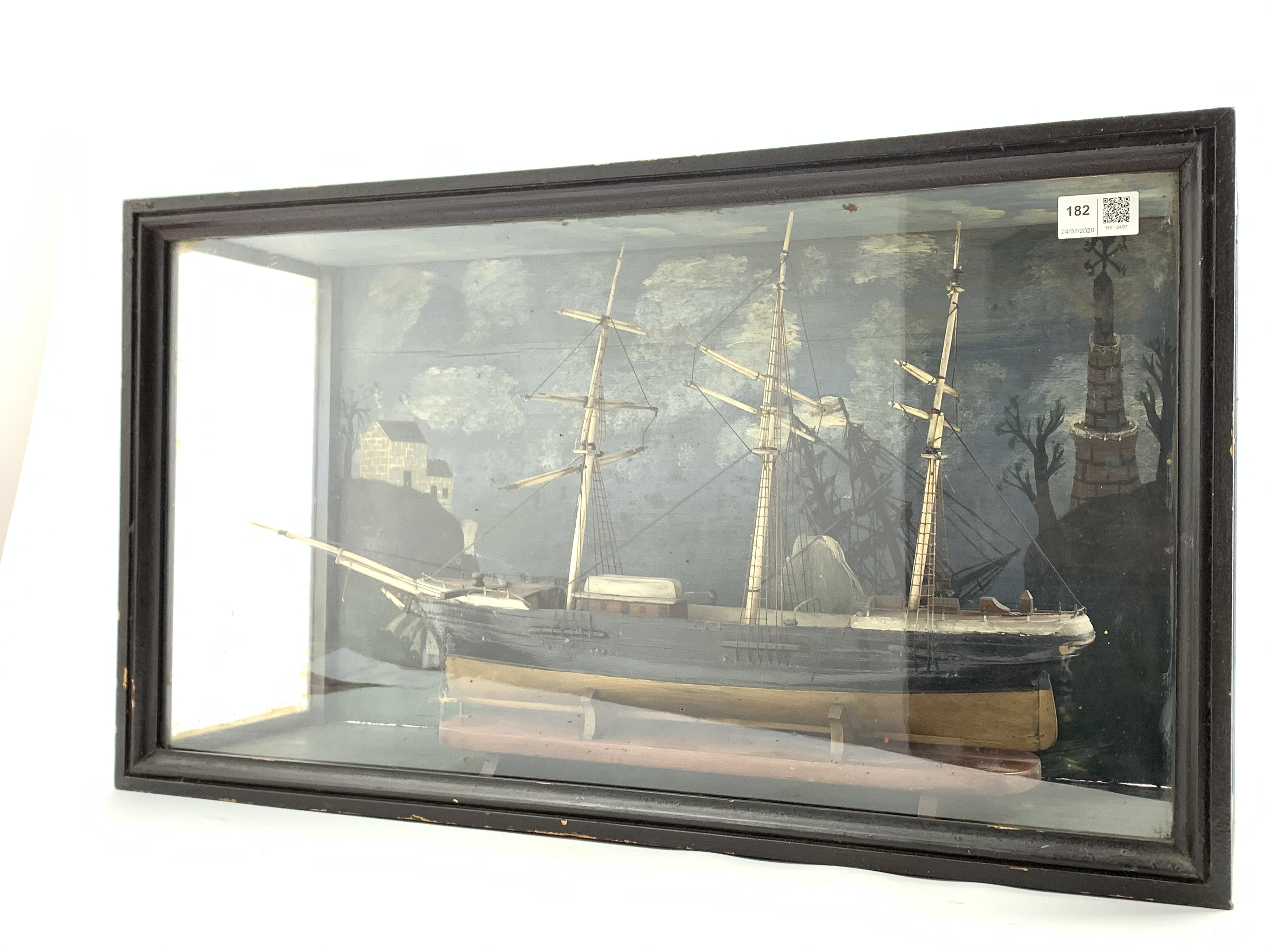 Model of a three masted sailing ship in a glazed display case with painted background 39cm x 67cm x