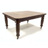 Victorian mahogany extending dining table, with two leaves, raised on turned fluted supports,