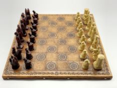 Leather chess board and set of composition chess pieces modelled as figures from the battle of