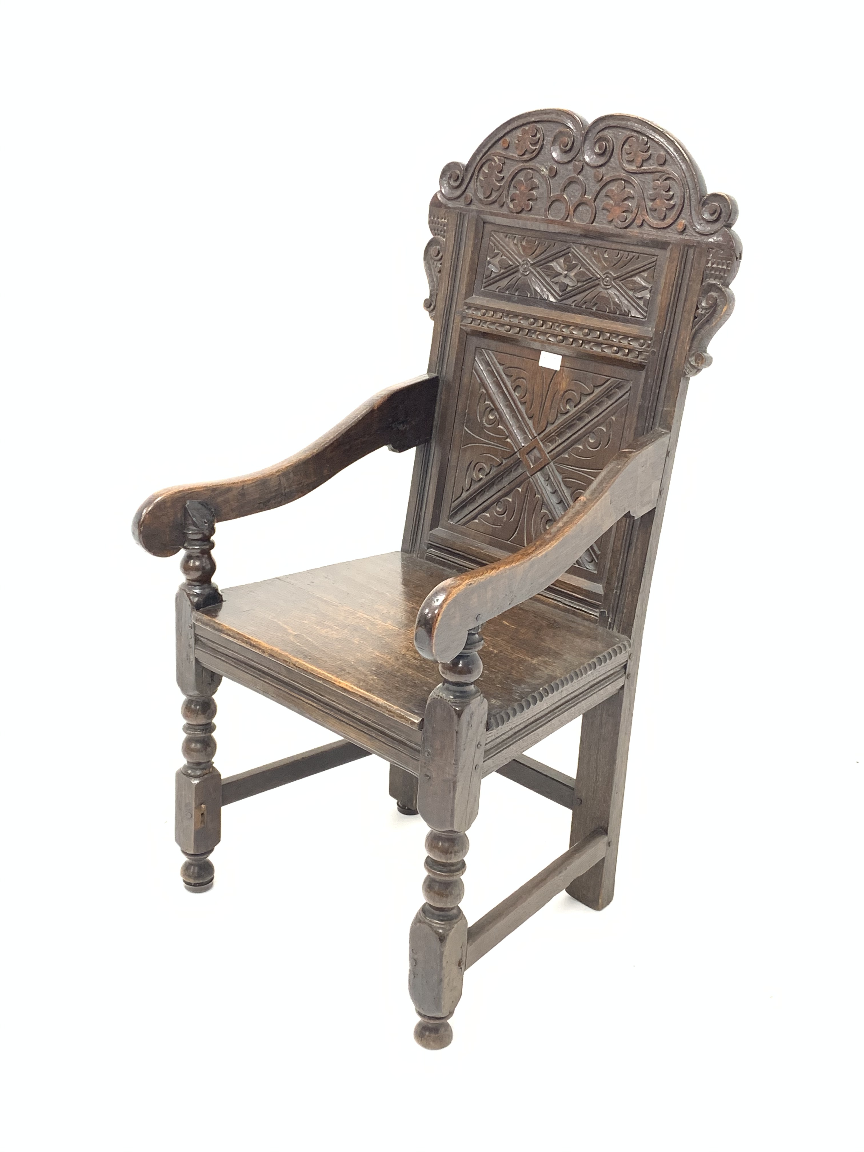 18th century and later oak Wainscote chair, scroll carved back panel,