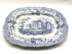 Early 19th Century blue and white meat plate transfer printed with the 'Ancient Ruins' pattern 54cm