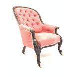 Victorian mahogany framed button back upholstered armchair, scroll carved arm terminals,