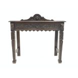 Victorian oak console table, raised arched back centred with carved green man mask,