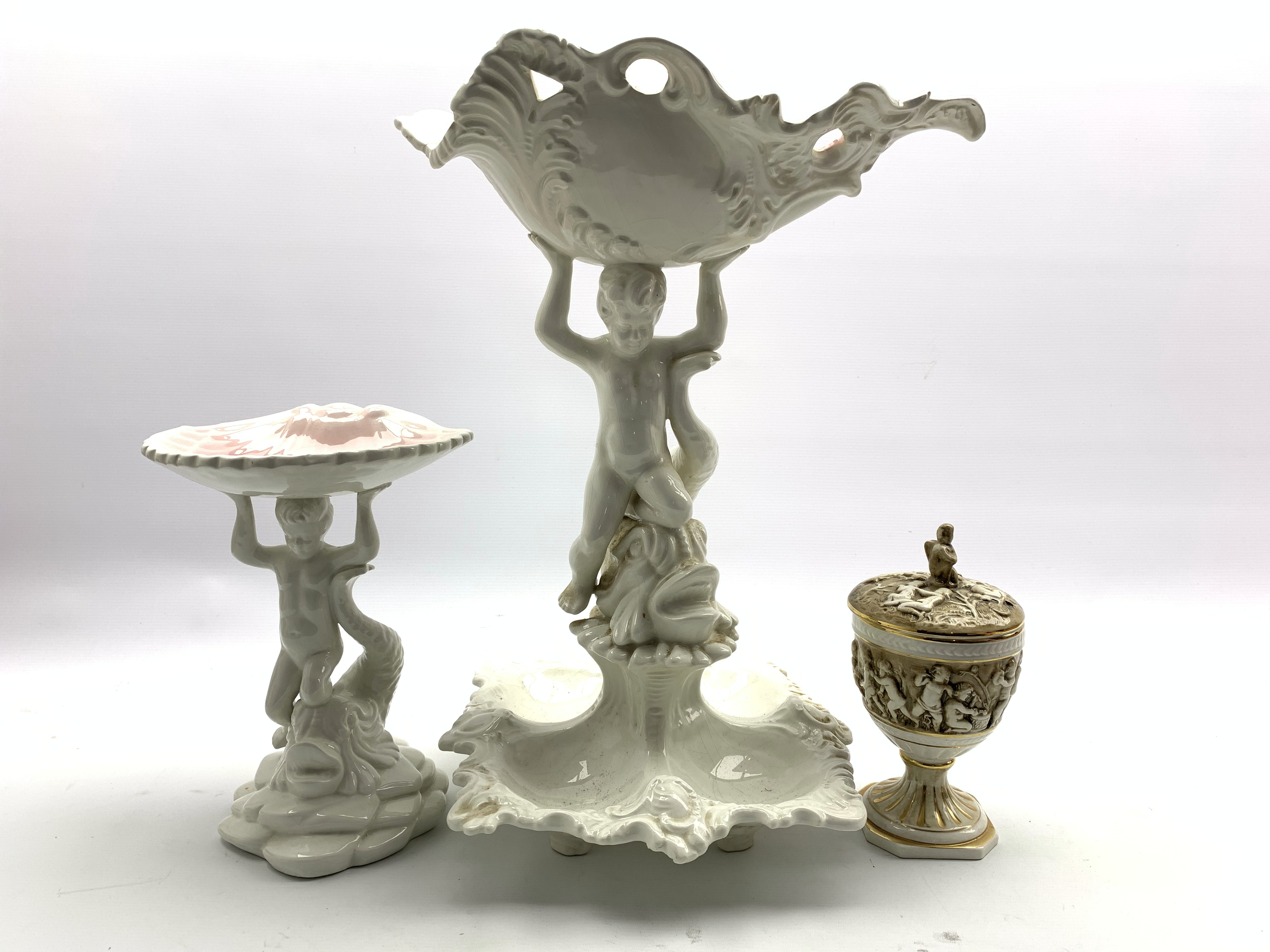 Capodimonte lidded urn and two table centrepieces both of similar design modelled as a boy kneeling