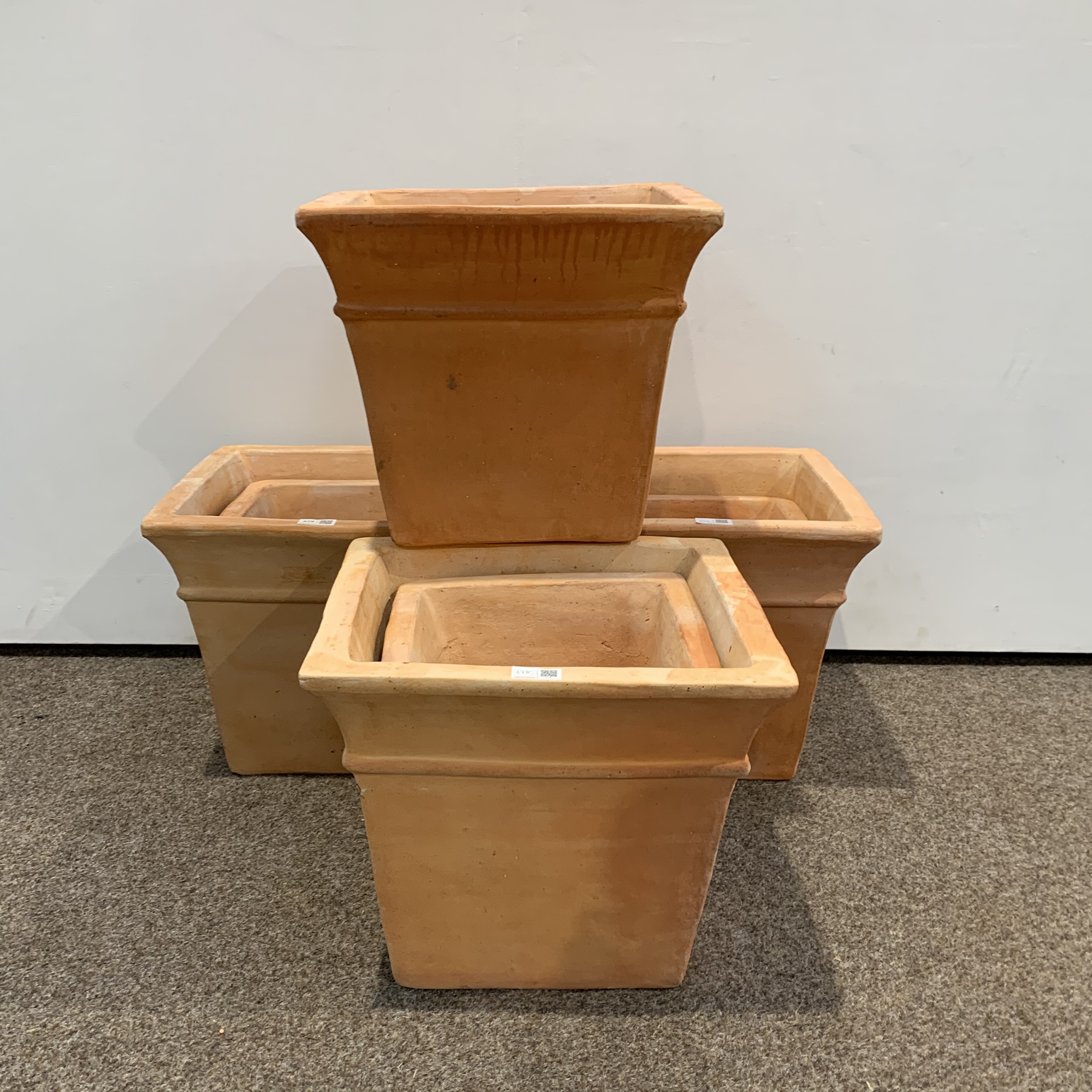 Four sets of two terracotta square tapered planters,