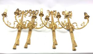 Set of four Georgian design gilt brass two branch wall lights with tied ribbon and tasselled