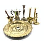 17th Century brass alms dish with embossed decoration D39cm, 18th Century brass candlestick,