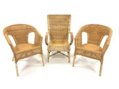 Pair of tub shaped cane armchairs, (W54cm) and another cane armchair,