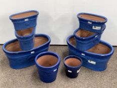 Eight blue glazed terracotta planters/plant pots, various shapes and sizes,