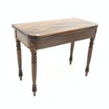 19th century mahogany tea table with fold over revolving top raised on turned supports,
