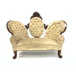 Victorian mahogany two seat settee, upholstered in deep buttoned cream damask,