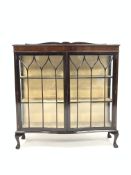 Early 20th century mahogany serpentine front display cabinet,