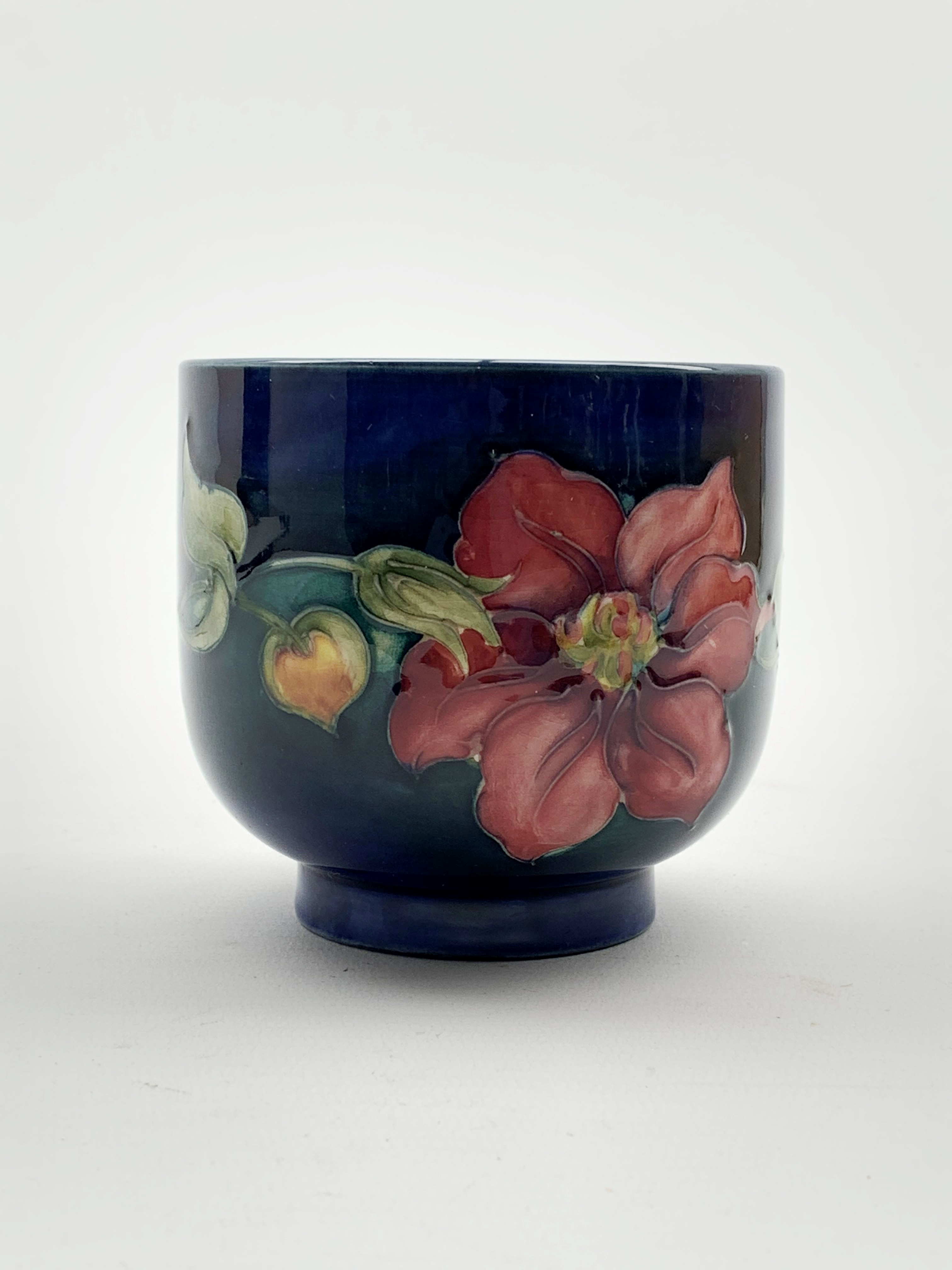 Moorcroft fern pot decorated in the Clematis pattern on a dark blue ground H8. - Image 2 of 3