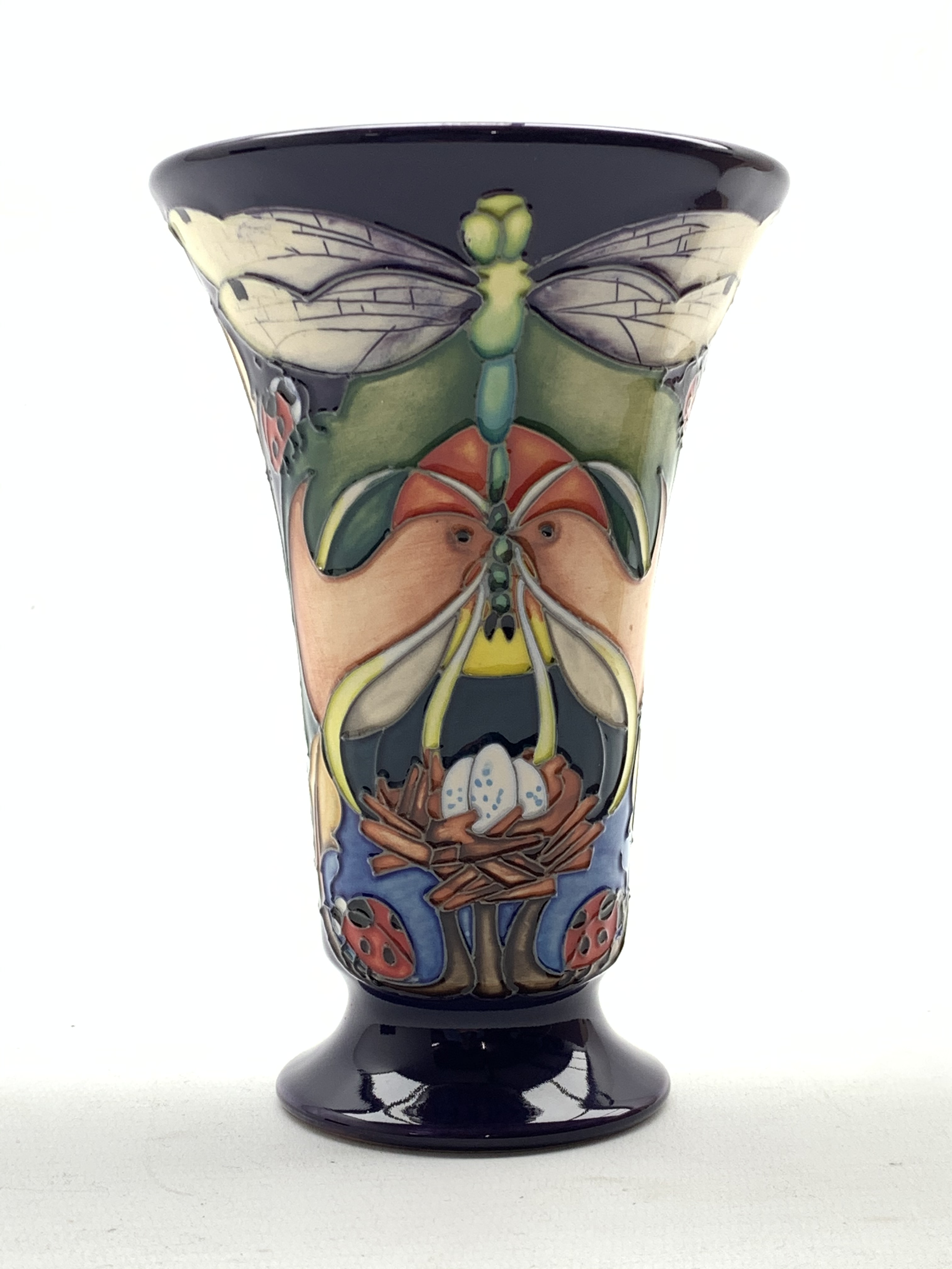 Moorcroft Homemaker pattern trumpet shape limited edition vase on a blue ground designed by Emma
