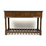 18th century style oak welsh dresser base, with two drawers raised on turned supports,