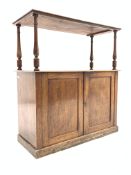 Victorian mahogany low cupboard with shelf raised on ring turned supports over two panelled doors