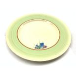 Clarice Cliff plate decorated with the crocus pattern within a pale green border D25cm