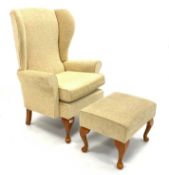 Wing back upholstered armchair with stool,