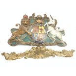 Moulded plastic coat of arms and three similar moulded plastic decorative items (4)