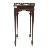 Edwardian mahogany urn stand, with galleried top over slide, raised on square tapered supports,