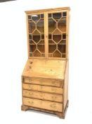 Georgian pine bureau bookcase, astragal glazed doors enclosing three adjustable shelves,