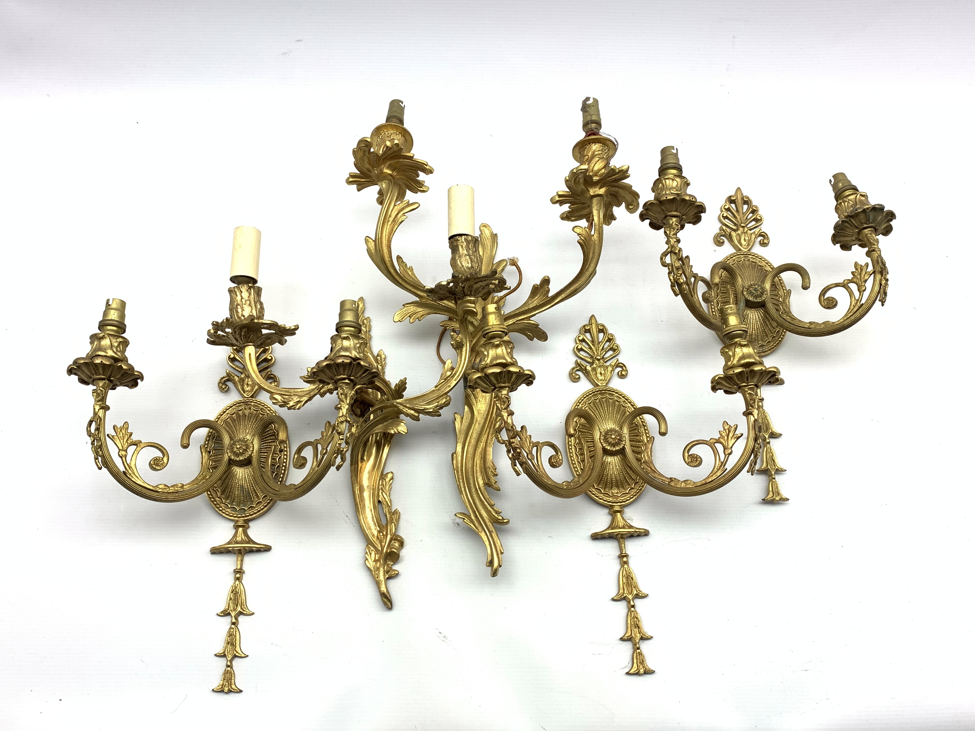 Three antique design gilt brass two branch wall lights with oval back plates H35cm and two others