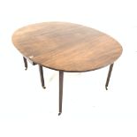 Georgian mahogany table with two 'D' shaped drop leaves raised on square tapered supports and brass
