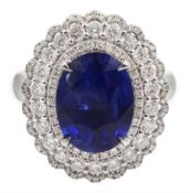 18ct white gold oval sapphire and diamond cluster ring/pendant, sliding shank with hidden bail, sta