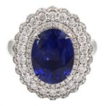 18ct white gold oval sapphire and diamond cluster ring/pendant, sliding shank with hidden bail, sta