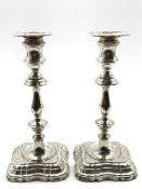 Pair of silver candlesticks with baluster stems and stepped square bases H24cm, Sheffield 1907 Make