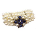 Three row cultured pearl bracelet, two spacers set with diamonds, on gold cabochon sapphire, diamon
