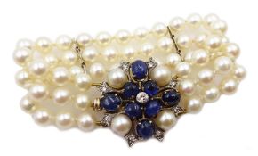 Three row cultured pearl bracelet, two spacers set with diamonds, on gold cabochon sapphire, diamon