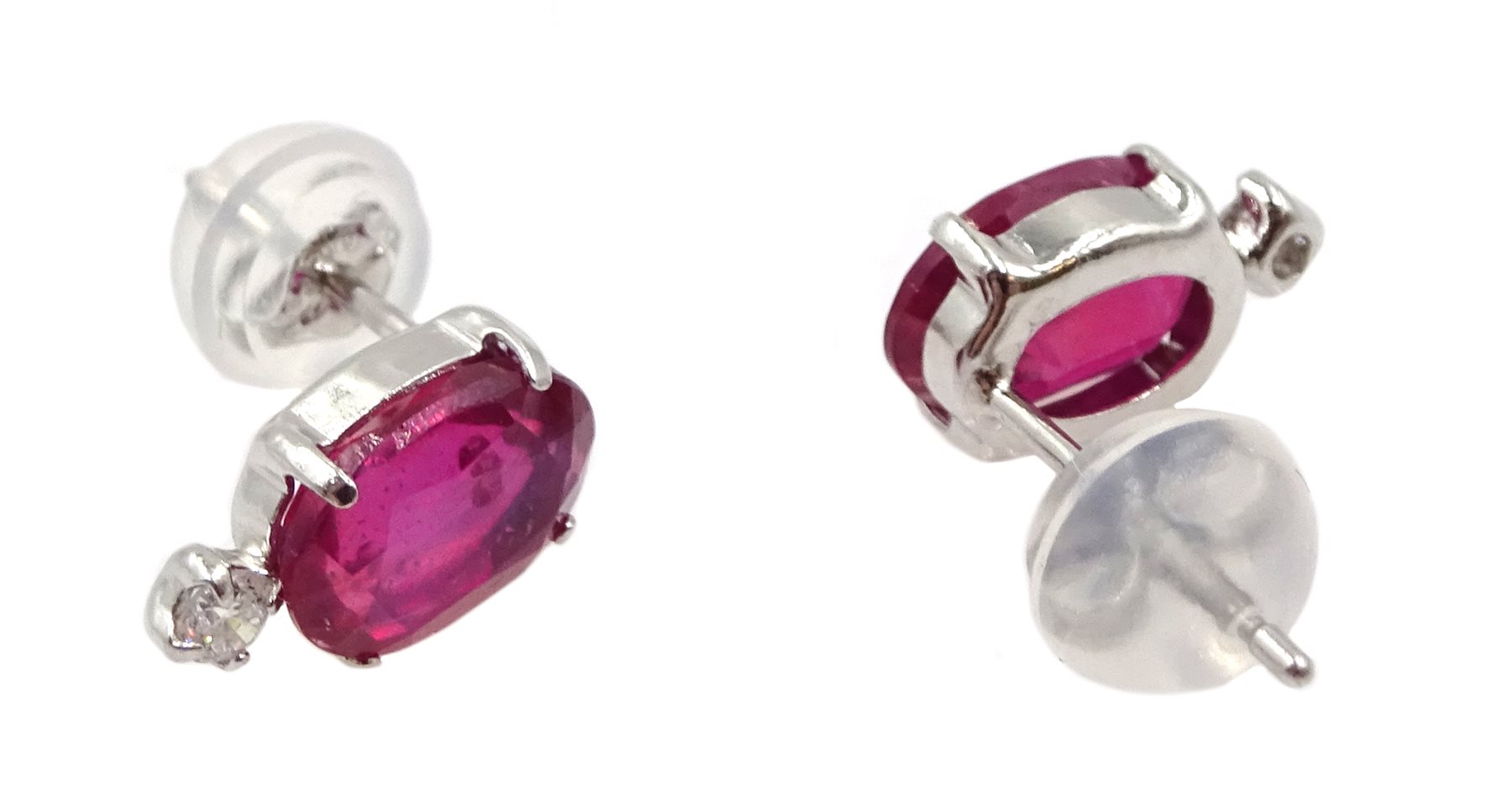 Pair of platinum oval ruby stud earrings, each set with a diamond, stamped Pt 900, ruby total weigh - Image 2 of 2