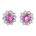 Pair of 18ct white gold pink sapphire and diamond cluster stud earrings, hallmarked, sapphire total