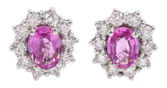 Pair of 18ct white gold pink sapphire and diamond cluster stud earrings, hallmarked, sapphire total