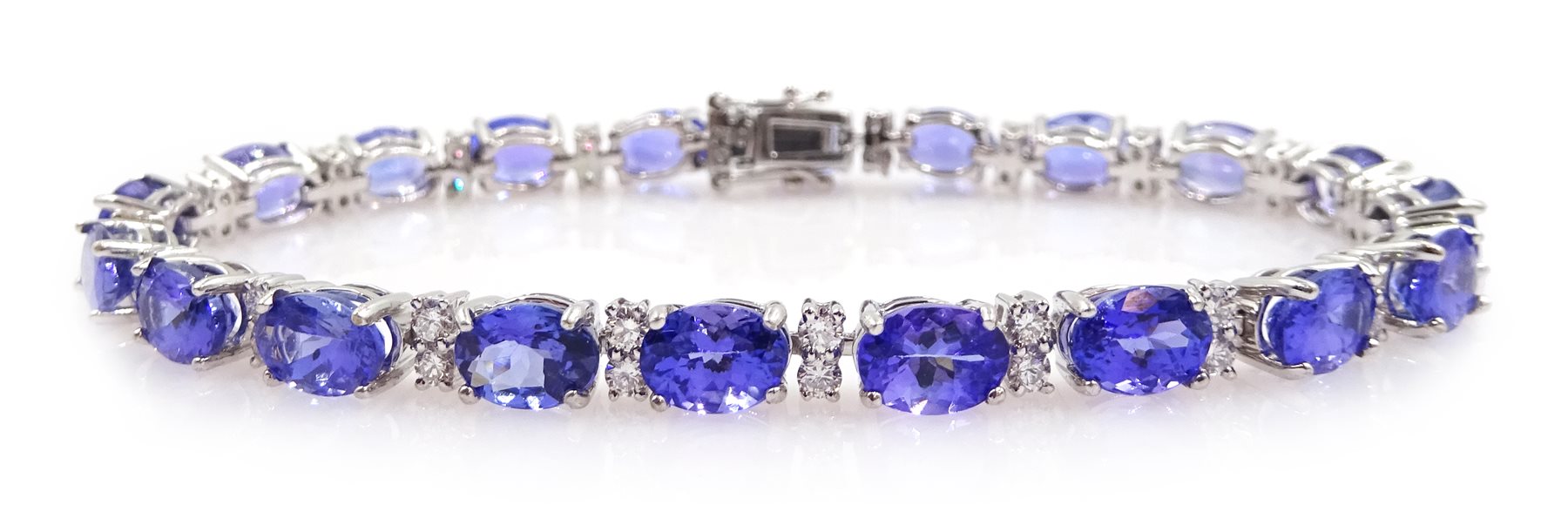 18ct white gold oval tanzanite and diamond link bracelet, hallmarked