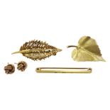 Two gold leaf brooches, pair of gold knot stud earrings and a gold bar brooch, all 9ct stamped or h