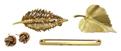 Two gold leaf brooches, pair of gold knot stud earrings and a gold bar brooch, all 9ct stamped or h