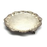 Late Victorian small silver salver with shell moulded piecrust border and claw and ball feet D20cm