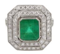 Platinum emerald and double row diamond ring, with diamond set shoulders, emerald approx 1.85 carat