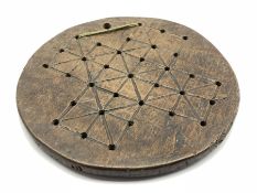 Antique oak circular games board the base inscribed '1740' and initialled 'MG' D24cm