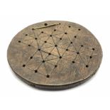 Antique oak circular games board the base inscribed '1740' and initialled 'MG' D24cm