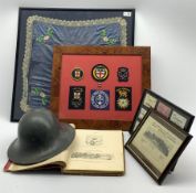 Framed square silk panel with coat of arms 50cm, frame containing nine LNER luggage labels, militar