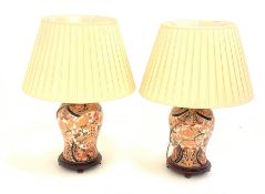 Pair of Chinese Imari style baluster form table lamps, decorated with panels of Dog of Fo on hardwo