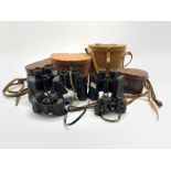 Pair of Prinz 8x30 binoculars, pair of Goerz Berlin binoculars and three others by Pathescope, Tasc