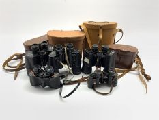 Pair of Prinz 8x30 binoculars, pair of Goerz Berlin binoculars and three others by Pathescope, Tasc