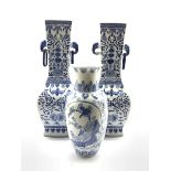 Pair of 20th Century Chinese blue and white vases decorated with flowers and with elephant head han